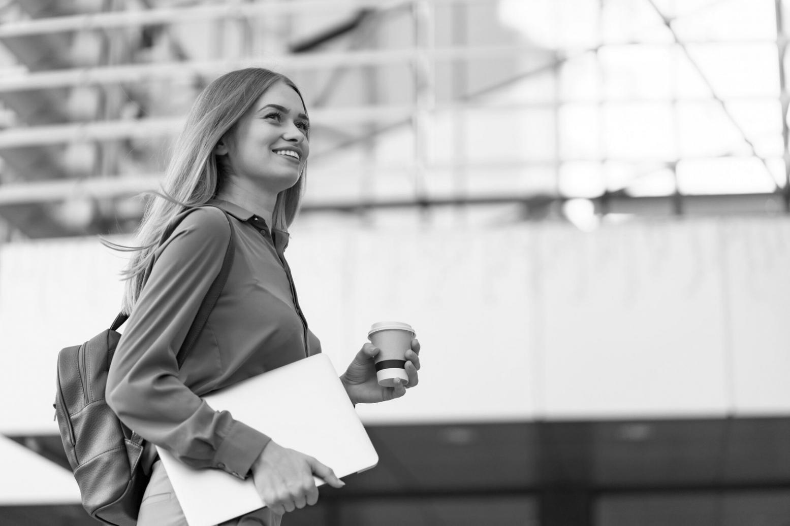 Modern workspace setup with laptop showing financial charts and analysis tools